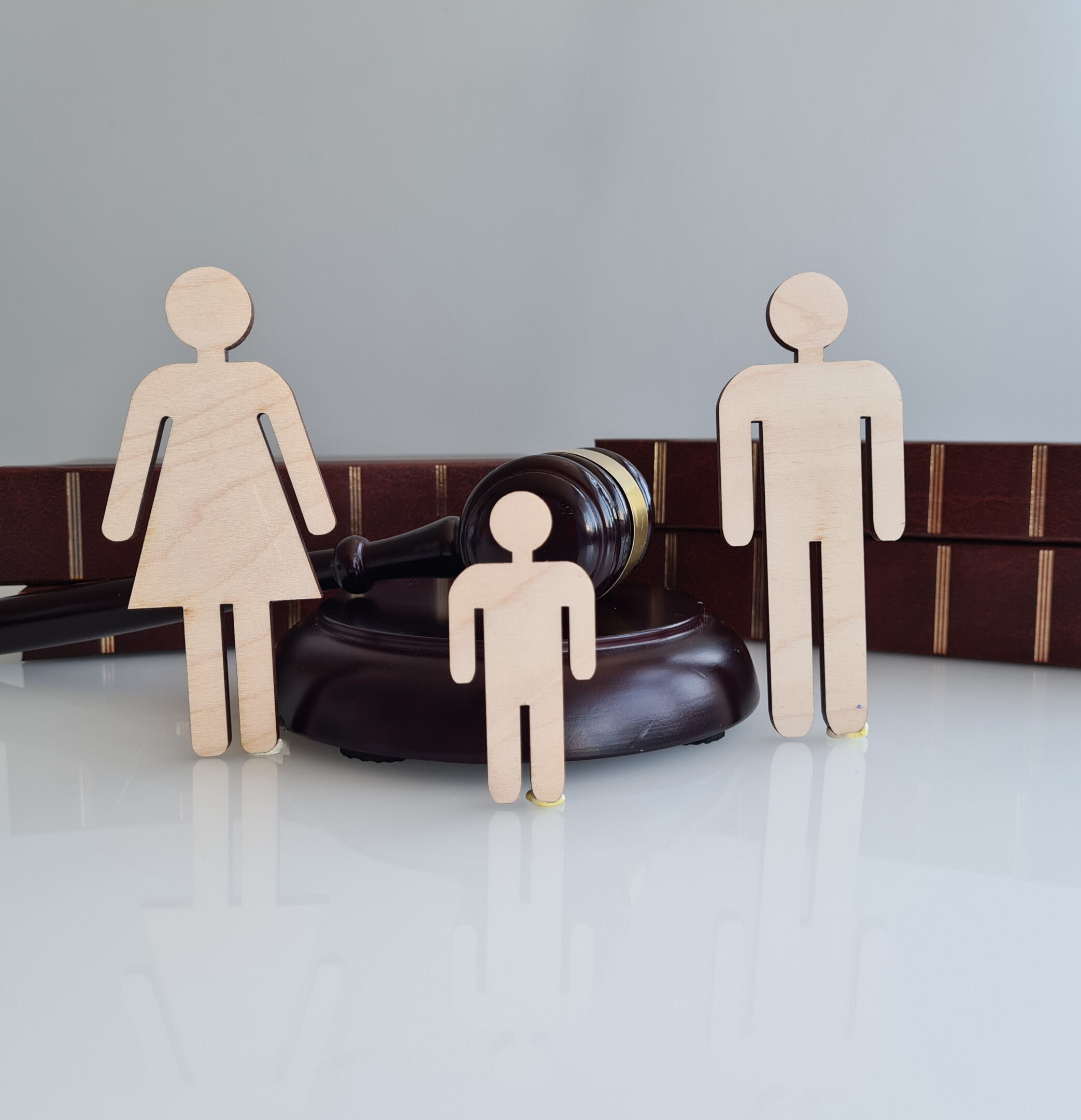 Wooden family figures and judge's gavel