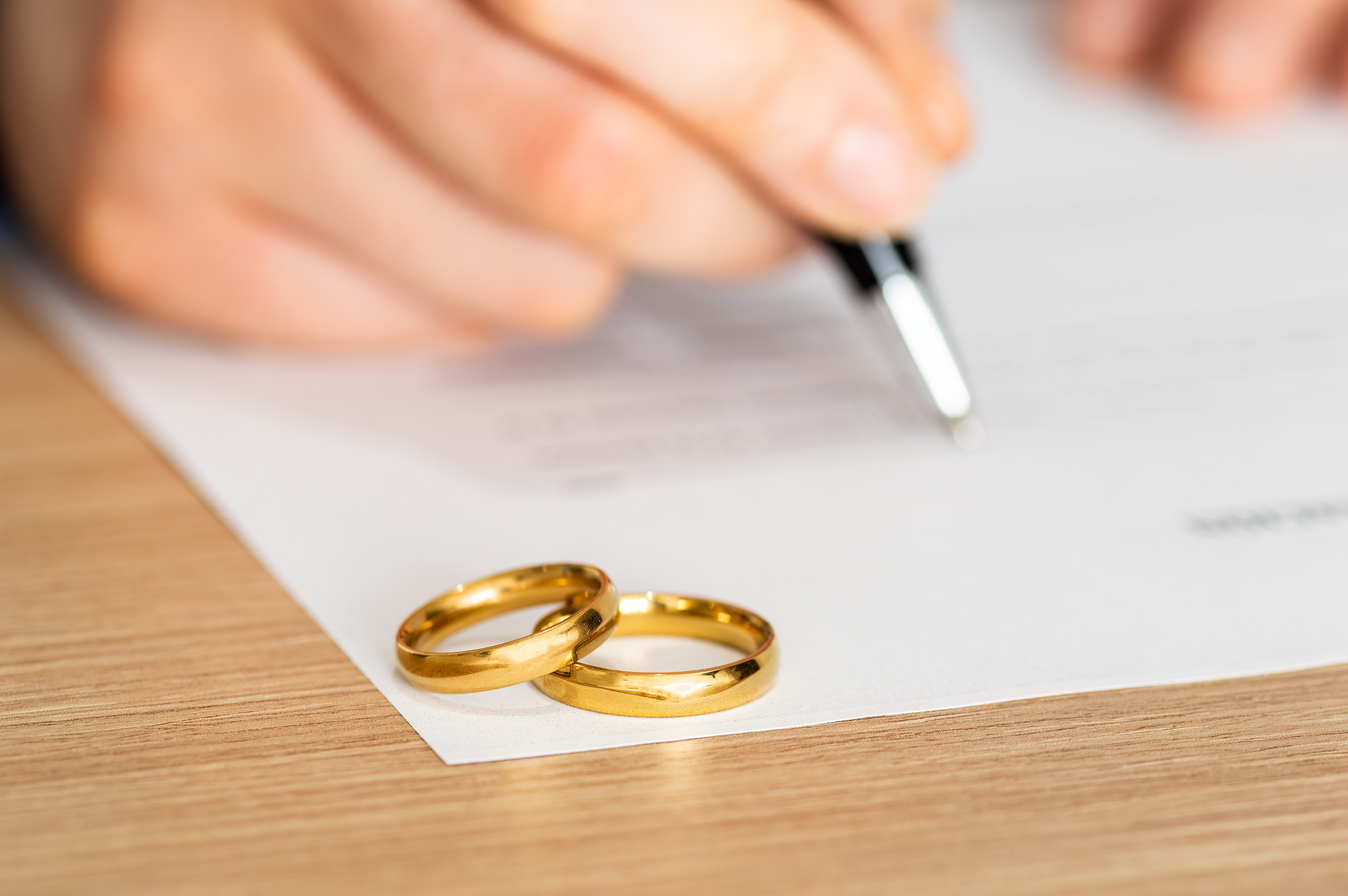 Wedding rings on divorce papers
