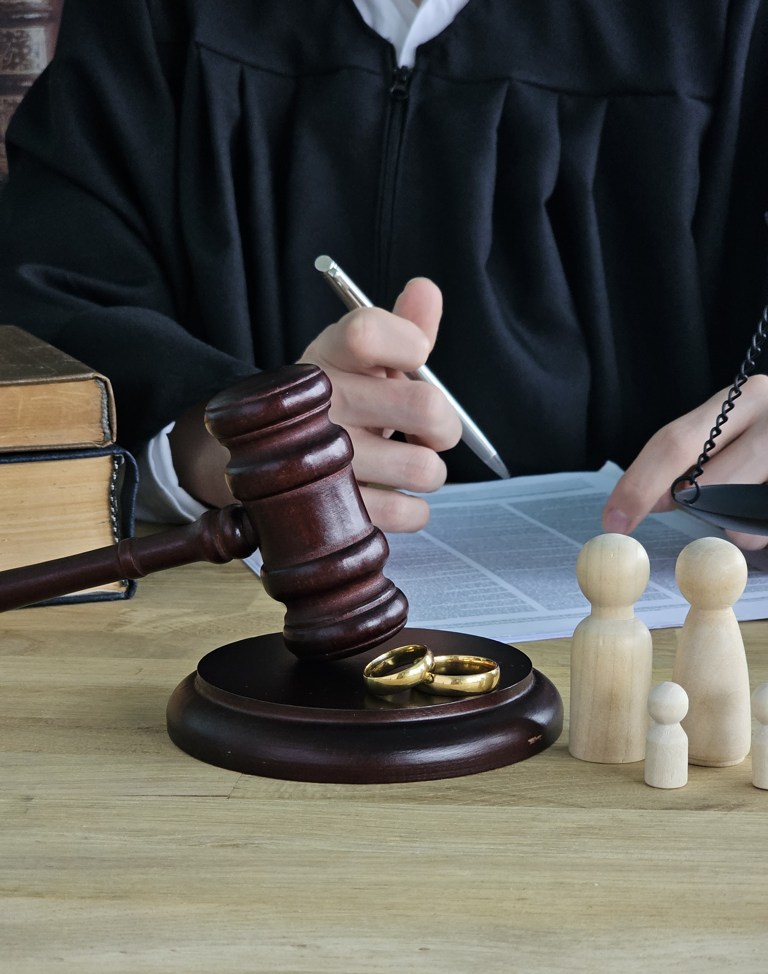 Divorce court scene with judge, gavel, rings