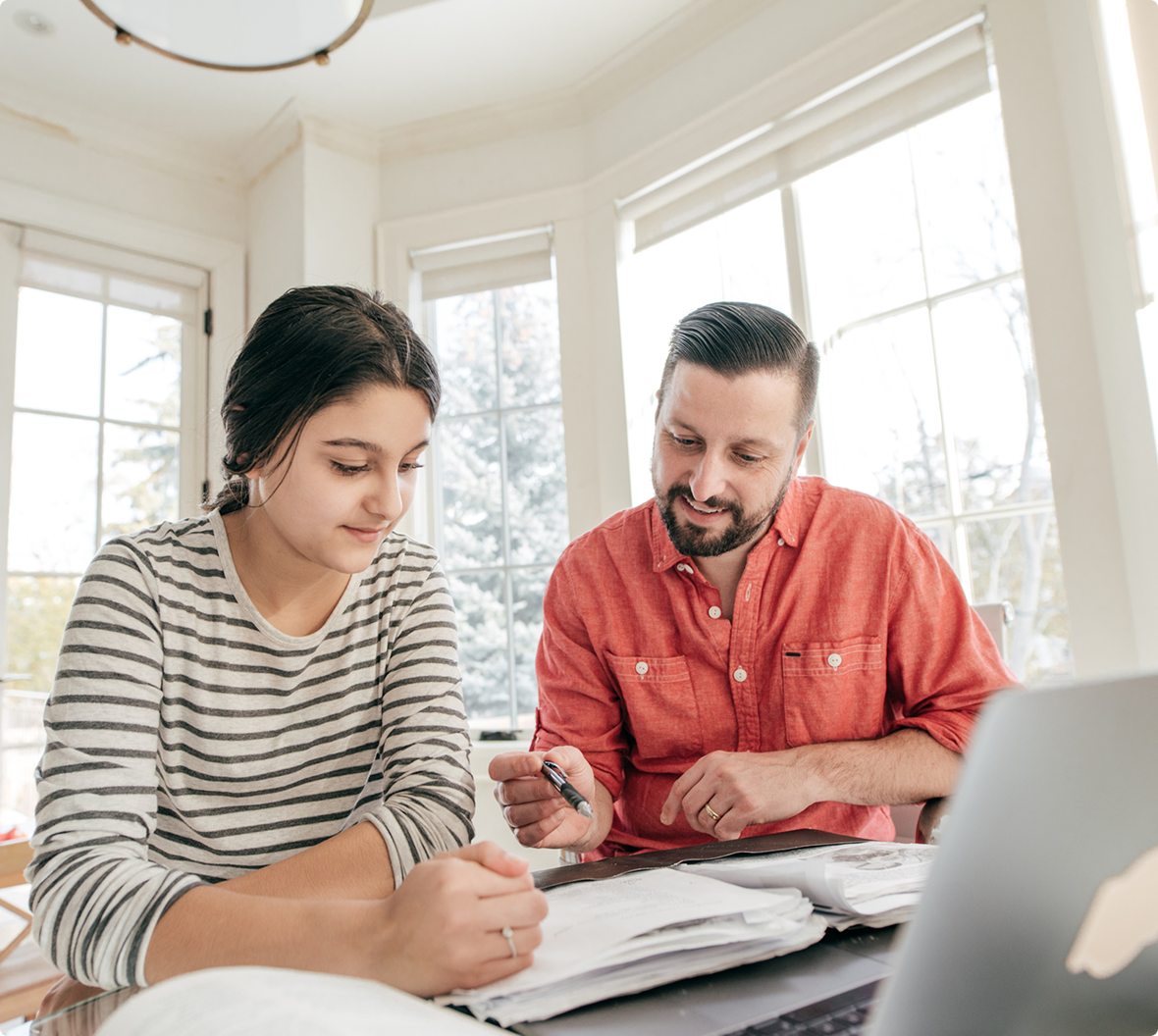 Dad helps teen with homework